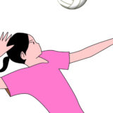スパイクを放つ女子バレーの選手